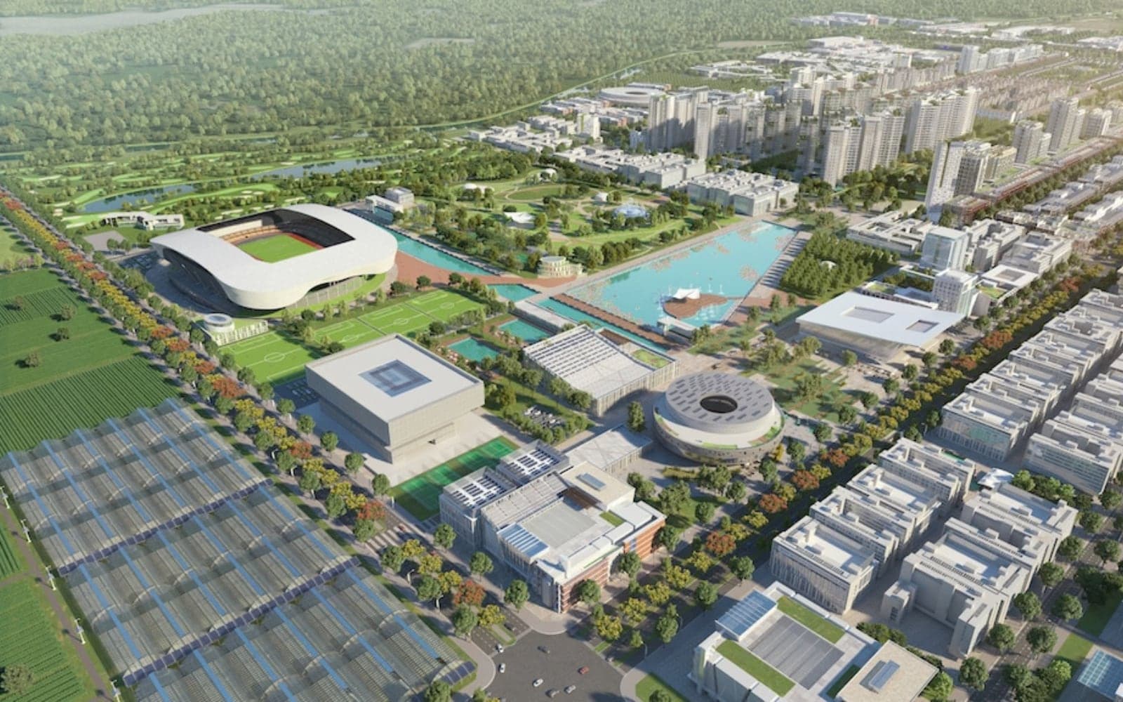 Aerial view of a planned industrial township with a stadium, offices and housing