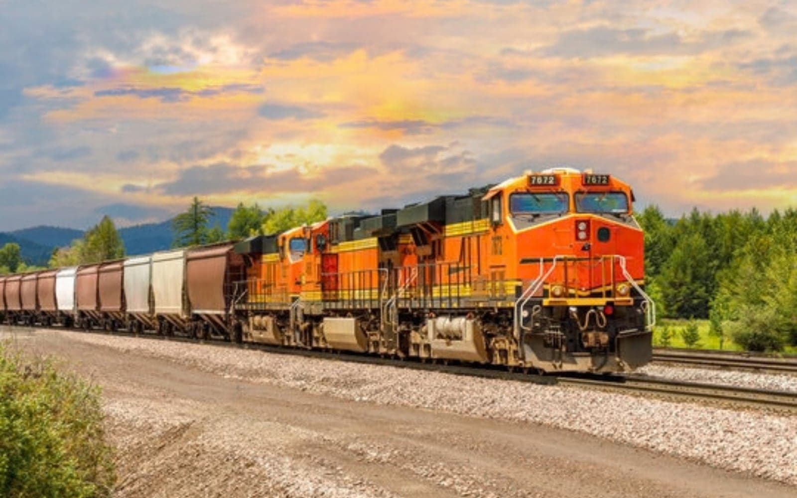 Freight locomotive hauling a train of wagons through the countryside