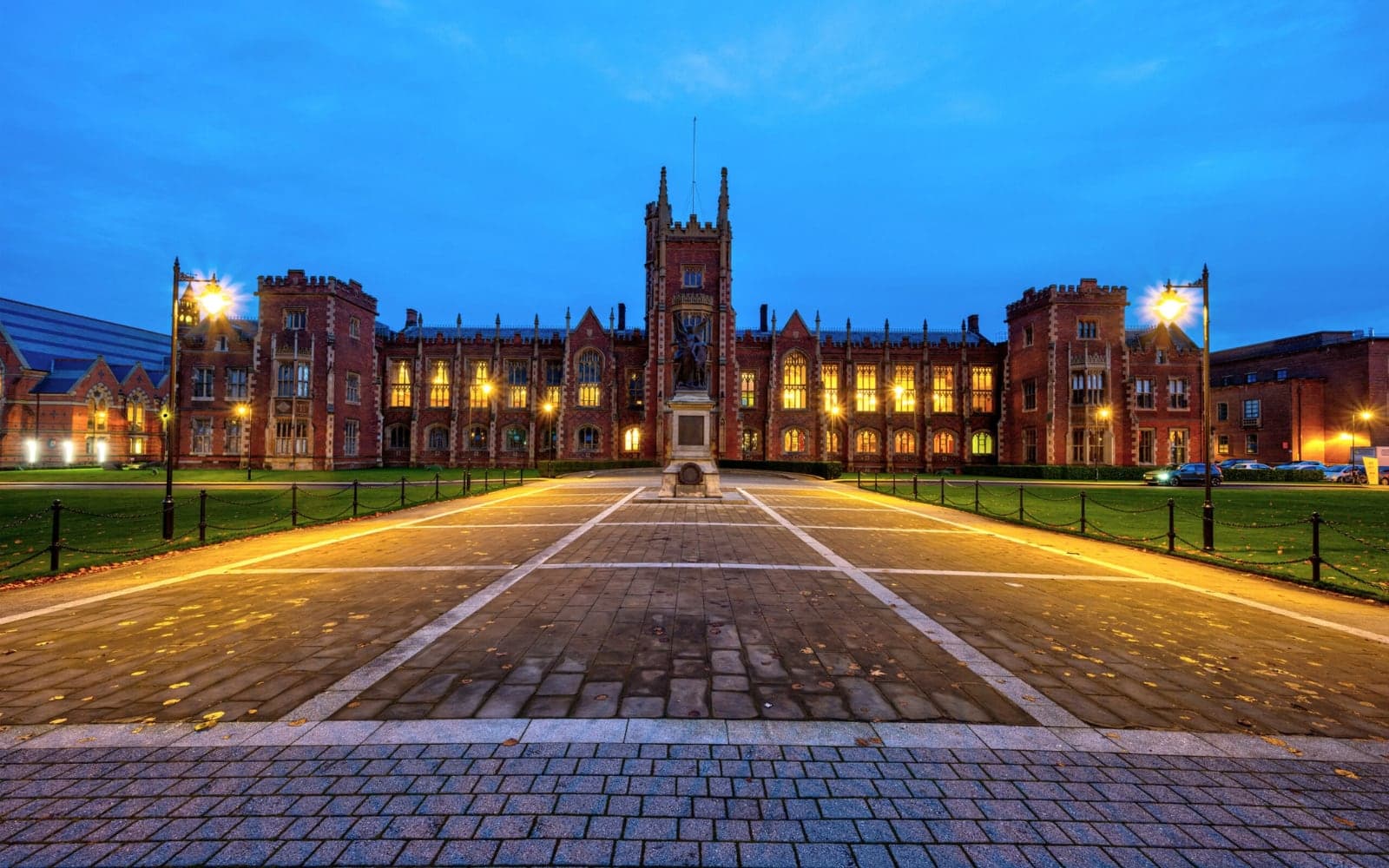 University campus avenue lit by street lights at dusk